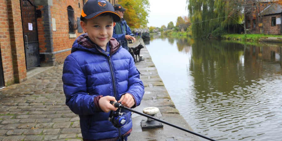 Boy fishing at Camden Lock