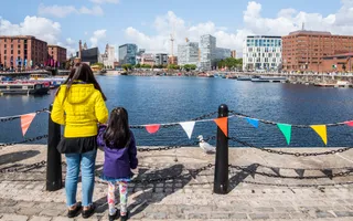 Mother and daughter looking out over a dock