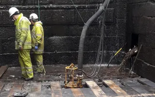 Workers restoring bottom of canal lock