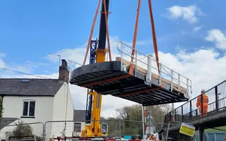 Bridge being lifted by crane