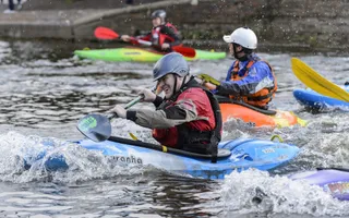 A man enjoying canoeing on the canal