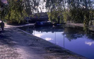 Person walking along towpath by Walsall Canal