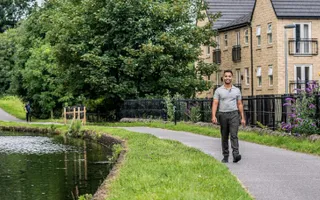 Dr Amir Khan walking along the canal