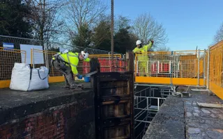 Workers at a lock gate