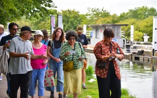 Group of people start a guided walk on the canal