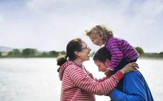 Family having fun by water