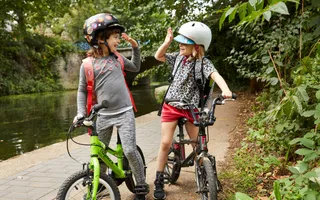 Children high-fiving on the towpath