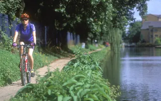 Cyclist on towpath of Hertford Union Canal