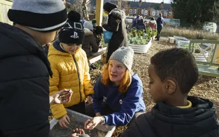 Adult teaching young children