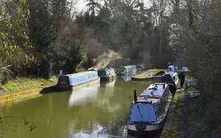 Moored boats on a canal early in the morning