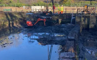 Digger in a canal removing silt