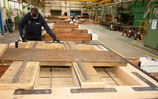 Engineering apprentice working on new lock gates in a workshop