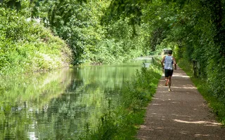 Man runs along the canal towpath