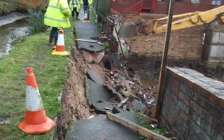 Towpath collapse with cones and digger