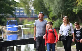 Family walking by the canal