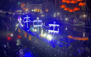 Canal boat at night time with old ship decorations