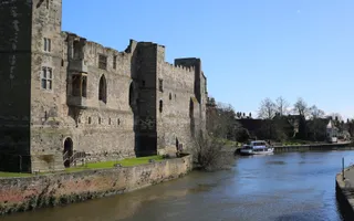Old castle on the edge of a river on a sunny day