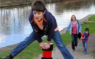 Family walking on canal towpath