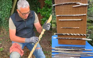 Person placed to the left holding piece of wood whilst sanding down the details. To the right there is a stack of wood with a small wall of whittled wood