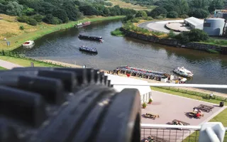 View of River Weaver from top of Anderton Boat Lift with boats on river