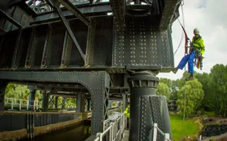 A maintenance engineer lowers down the Anderton structure on a rope