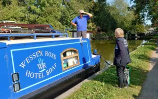 Waterways Chaplain the Rev. Pat Willis chats with the Wessex Rose Hotel Boat