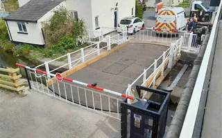 Looking down on bridge with barries at each end