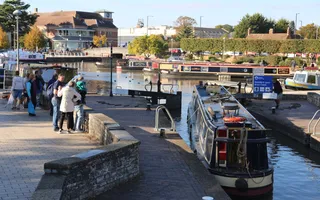 Boat passing through lock into a basin