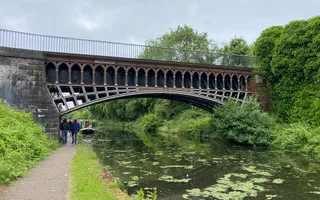 A photograph of the cast iron Engine Arm Aqueduct, an ornate structure crossing the New mainline canal