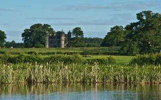 Stately home viewed across field from Birmingham & Fazeley Canal