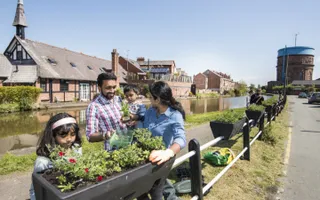 Family plant flowers along the canal towpath at Chester