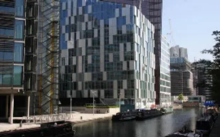 Boats moored alongside buildings at Paddington Basin, London