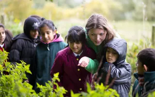 Explorers education volunteer with children