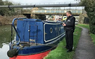 Boat licence support officer checking a boat