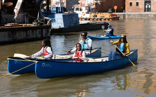 Family canoeing on a canal
