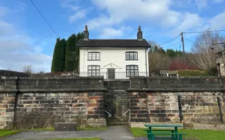 A white canal cottage above Harecastle Tunnel