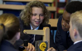 Group of children making a crane