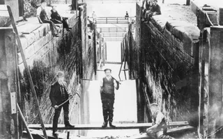 Old black and white photo of workers building a lock