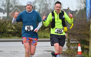 Two runners on a road