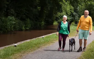 A couple walking along the towpath