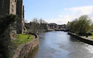 A wide stretch of the River Trent flows past an old mediaeval castle