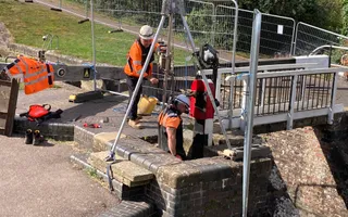 Workers repairing lock gate