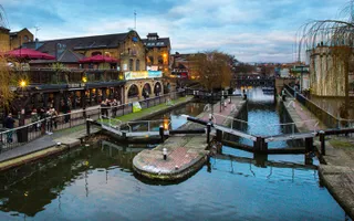 Aerial view of double locks in Camden with a busy pub on the bank