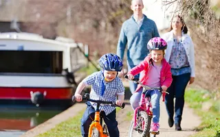 A family with bikes on the canalside