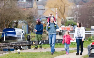 Family walking by the canal