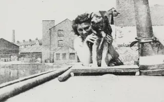 Boatwoman and dog on River Nene