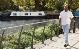 Man walking along the canal
