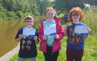 Children receive their Let's Fish! certificates