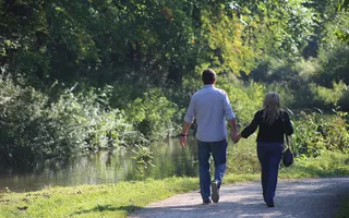 Couple walking hand in hand at Monkton Combe on the Kennet & Avon Canal