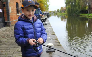 Boy fishing at Camden Lock